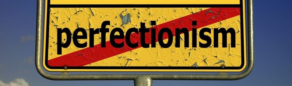 Board crossing out the word perfectionism