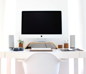 A neatly organized workspace with a desktop in the middle